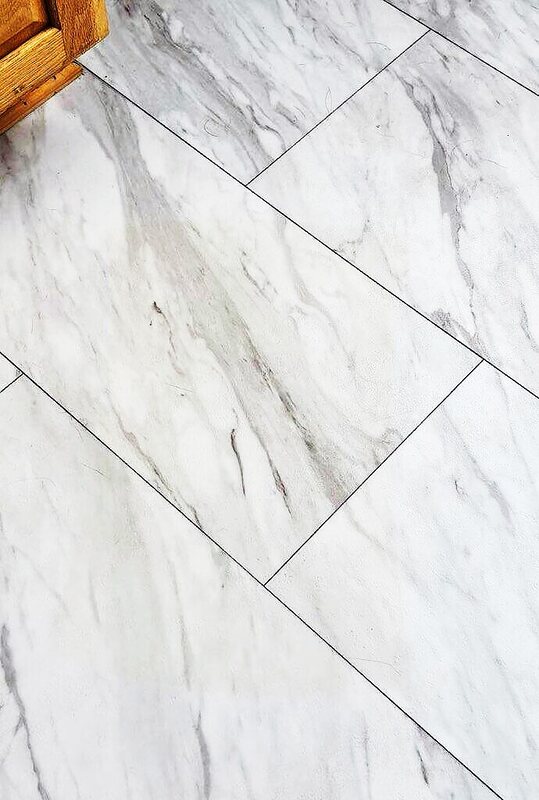 Close-up of a clean marble-effect tile floor showing grout lines